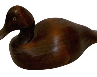 748 - Wood Duck Decoy 6.5"x13"x6" (Description): Wood duck decoy measuring 6.5 inches by 13  inches by 6 inches. Features glass eyes and a  carved wooden body with a rich brown finish.