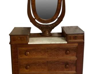 687 - Antique Victorian Dress w/ Wishbone Mirror (Description): Antique dresser with mirror by Mitchell. This  elegant piece features a marble top surface  flanked by two small accessory drawers, with  three large drawers below fitted with wooden  knobs. The tilting oval mirror is mounted on a decoratively carved lyre-form support.  Measures 72 inches tall by 41 inches wide by  19.5 inches deep.