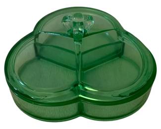 83 - Green Glass Dish w/ Lid 4"x7" (Description): Green glass dish with lid featuring a clover  or trefoil shape with three divided sections.  The lid has a decorative finial handle.  Measures 4 inches by 7 inches.