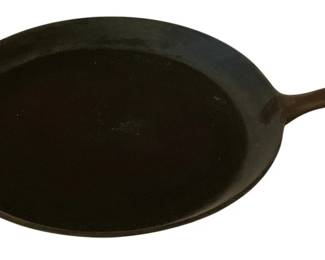 240 - Griswold Cast Iron Skillet 11.5" Round (Description): Griswold cast iron skillet measuring 11.5  inches round. This classic American-made  piece features the quality construction  Griswold is known for, with a sturdy handle  and helper tab for easy handling.