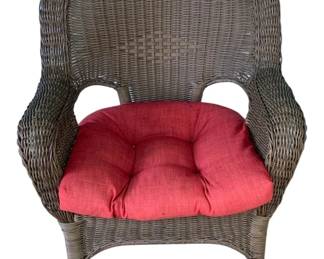 10 - Wicker Chair w/ cushion - 35"x29"x27" (Description): A wicker chair with a classic woven design.  The chair features curved arms and a high  back. Measures 35 inches high by 29 inches  wide by 27 inches deep.