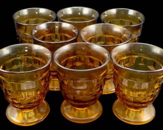 356 - 8 Amber Glass "Cubist" Juice Glasses 4.5"x3.5" (Description): A set of amber glass "Cubist" glasses  featuring a geometric faceted pattern. Each  glass measures 4.5 inches by 3.5 inches.