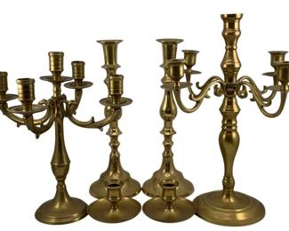 454 - Assorted Brass Candleholders (Description): A lot of brass candleholders featuring a  variety of styles including candelabras and  single candlesticks. The collection displays  traditional turned brass construction with  multiple arm configurations.