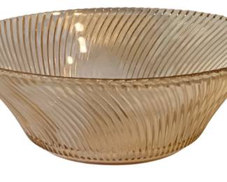 651 - Pink Glass Bowl 3.5"x9" (Description): Pink glass bowl featuring a swirled ribbed  design. Measures 3 1/2 inches tall by 9  inches in diameter.