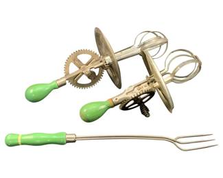 354 - 3 Antique Kitchen Utensils (Description): A collection of three antique kitchen  utensils featuring coordinating green painted  wooden handles. The set includes a  hand-cranked rotary egg beater and a  long-handled cooking fork, representing classic early kitchen tools.