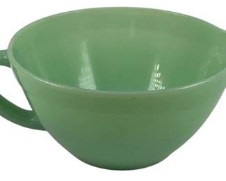 464 - Fire-King Jadeite Mixing Bowl (Description): Fire-King Jadeite mixing bowl featuring the  classic green opaque glass, with a handle and  pour spout for convenient use. Measures 4  inches tall by 9 1/5 inches wide by 7 1/5  inches deep.