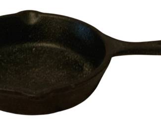 245 - Lodge Cast Iron Skillet 4" Round (Description): Lodge cast iron skillet measuring 4 inches  round. A compact and versatile piece of  cookware suitable for individual servings or  small cooking tasks.