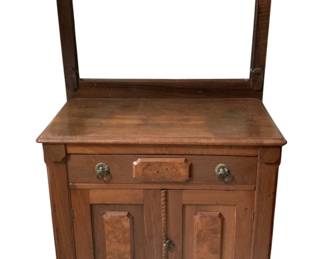 206 - Antique Washstand w/ towel bar 51"x31"x15" (Description): Antique washstand featuring a single drawer  with decorative pulls above a two-door  cabinet. The piece includes an upper towel  bar frame. Measures 51 inches wide by 31  inches tall by 15 inches deep.