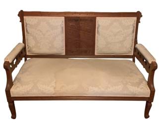 138 - Antique Settee 38"x51"x23" (Description): Antique sofa featuring a carved wooden frame  with upholstered seat, back panels, and  armrests. The piece measures 38 inches high  by 51 inches wide by 23 inches deep.