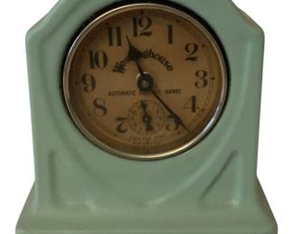 223 - Westinghouse Enamel Clock 6"x6"x4.5" (Description): Westinghouse clock featuring an automatic  electric range timer face. The clock has a  distinctive Art Deco-style case in a mint  green enamel finish with a cream-colored dial  displaying Arabic numerals and a smaller sub dial. Measures 6 inches wide by6 inches deep  by 4.5 inches tall. Used as is electric/electronic/mechanical  item. No guarantee all components, untested.