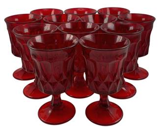 457 - 12 Ruby Red Goblets 6.5"x3.75" (Description): A twelve-piece set of ruby red goblets  featuring a footed pedestal design. Each  goblet measures 6.5 inches tall by 3.75  inches in diameter.