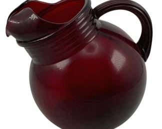523 - Red Glass Ball Pitcher 6.5"x7"x6" (Description): Red glass pitcher with a rounded body and  ribbed neck detail. Measures 6 1/2" x 7" x  6".