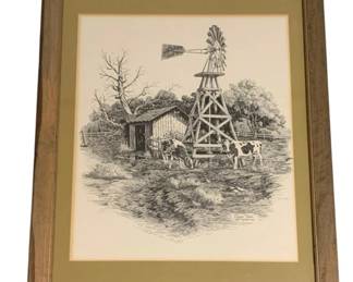 784 - Framed Print 25.5"x19" (Description): Framed print depicting a rural scene with a  windmill, cabin, and surrounding trees. The  print is double matted in an olive green and  cream mat and set within a wooden frame.  Measures 25.5 inches by 19 inches.