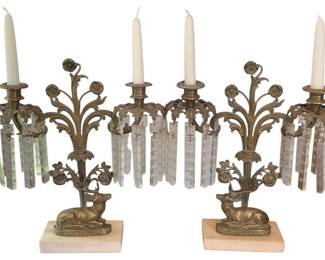 53 - 2 Candelabras featuring a Deer & a Floral Motif (Description): 2 candleholders featuring ornate metalwork  with a Deer, floral motifs and crystal  prisms. The candleholders rest on marble  bases and measure 18 inches by 12.5 inches.