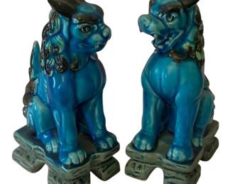 84 - 2 Ceramic Chinese Foo Dogs 8"x3"x4.5" (Description): 2 ceramic foo dogs with a vibrant turquoise  blue glaze and contrasting dark accents. Each  figure is seated on a decorative base.  Measures 8" x 3" x 4.5".