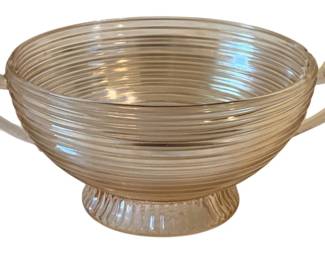 652 - Pink Glass Mixing Bowl 5"x12"x9" (Description): Pink glass mixing bowl featuring two handles  and a footed base. Measures 5 inches by 12  inches by 9 inches.