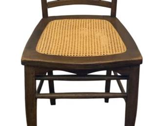 516 - Vintage Chair 32.5"x16"x15" (Description): Vintage chair featuring a spindle back design  and cane seat. Measures 32.5 inches tall by  16 inches wide by 15 inches deep.
