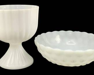 360 - 2 Milk Glass Items 7.5"x8" (Description): A two-piece lot of milk glass items. The lot  includes a footed compote with ribbed design  and a scalloped edge bowl with thumbprint  pattern. Measurements: 7.5" x 8".