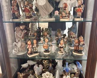 Assorted Hummels and other figurines.