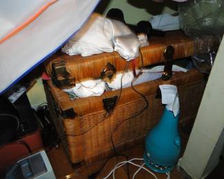 Wicker chest filled with clothes etc.