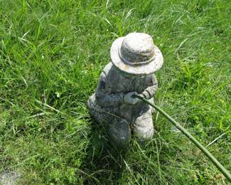 Cement boy fishing statue