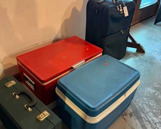 Estate Sale Assortment: Vintage Coleman Cooler, Blue Plastic Cooler, and Hard-Shell Suitcase