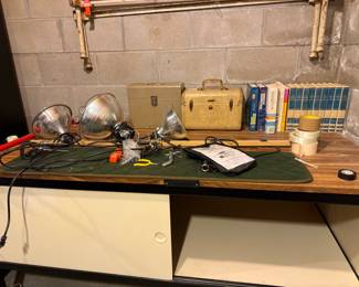 Vintage Utility Workbench with Assorted Workshop Tools and Books
