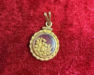 14 karat gold with tiny gold nuggets from California on the inside