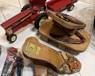 Vintage metal Farmall tractor and WWII era wood shoes from Japan