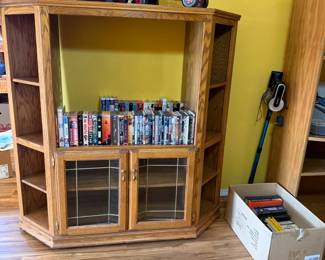 TV Cabinet, VHS, DVDs, tractor and truck decor, books, vacuum