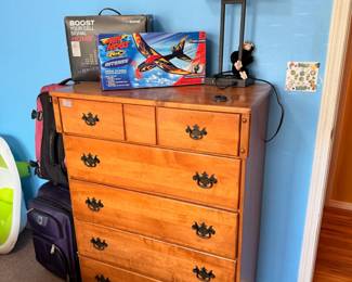 chest of drawers, lamp, cell booster, model plane
