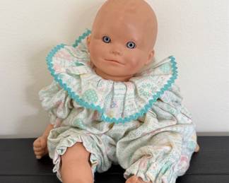 Vintage Baby Doll with Floral Romper and Ruffled Collar