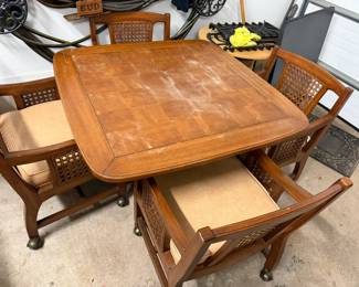 square table with 4 cane rolling chairs