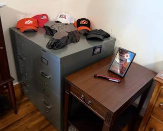 file cabinets, small tale, clock, hats
