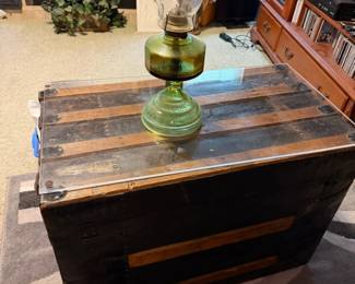 trunk, oil lamp, rug
