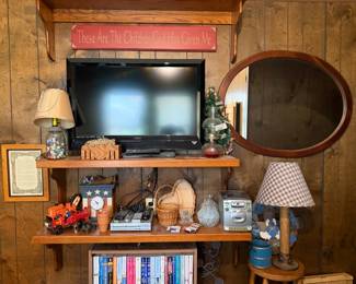 TV, decor, mirror, lamps, books