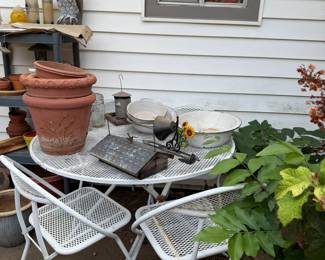 patio table with chairs, flower pots, enamel ware