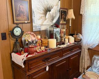 bottom half of china cabinet, the top is in the garage, candles, decor