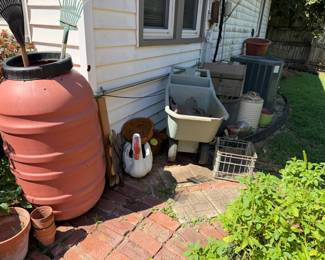 swan planter, wheel barrow, milk crate