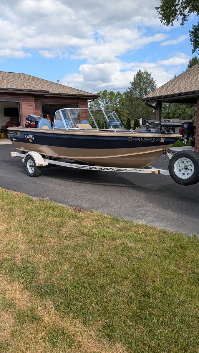 1998 Lund boat 1600 Pro Sport full windshield included roller trailer, 1998 Mercury 90 hp., 2017 Mercury 9.9 hp. More info available