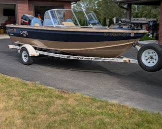 1998 Lund boat 1600 Pro Sport full windshield included roller trailer, 1998 Mercury 90 hp., 2017 Mercury 9.9 hp. More info available