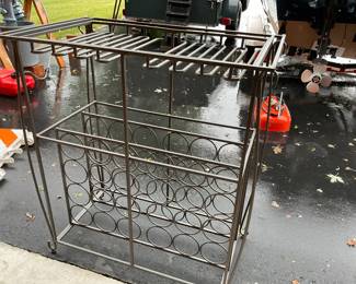 Wine rack will hold 24 bottles plus glasses tempered glass on top plus on shelf .