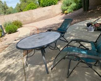 Round Glass Top Patio Table And Two Recliners