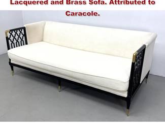 Lot 1529 Hollywood Regency Style Black Lacquered and Brass Sofa. Attributed to Caracole.