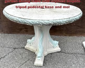 Lot 1610 Cast stone Neoclassical style garden dining table with stylized dolphin tripod pedestal base and mol