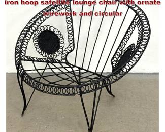 Lot 1579 MidCentury Modern black wrought iron hoop satellite lounge chair with ornate wirework and circular 