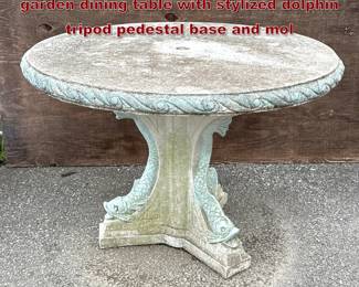 Lot 1604 Cast stone Neoclassical style garden dining table with stylized dolphin tripod pedestal base and mol