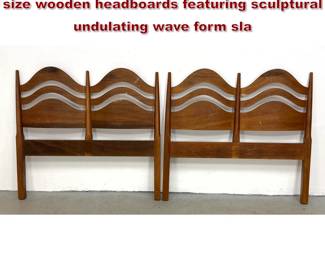 Lot 1435 Pair of midcentury modern twin size wooden headboards featuring sculptural undulating wave form sla
