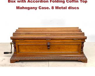 Lot 1731 Regina 27 Inch Disc Playing Music Box with Accordion Folding Coffin Top Mahogany Case. 8 Metal discs