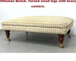 Lot 1754 Large Oversized Upholstered Ottoman Bench. Turned wood legs with brass casters. 